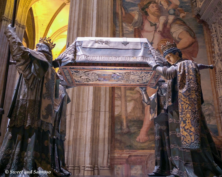 Tomb of Christopher Columbus held by four figures representing the kingdoms of Spain